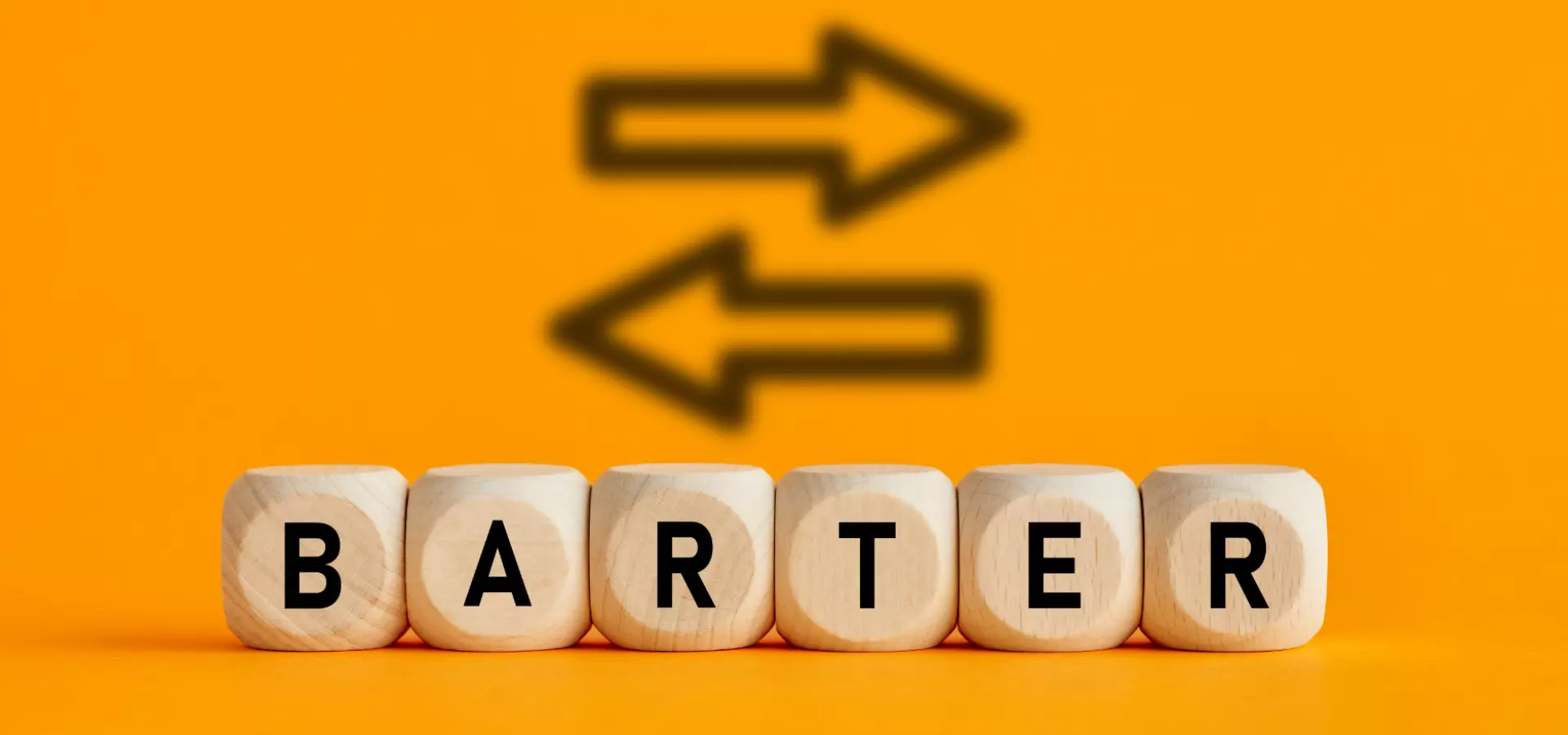Wooden cubes with the letters spelling 'barter' in front of a yellow background, and two arrows (one pointing left and one pointing right).