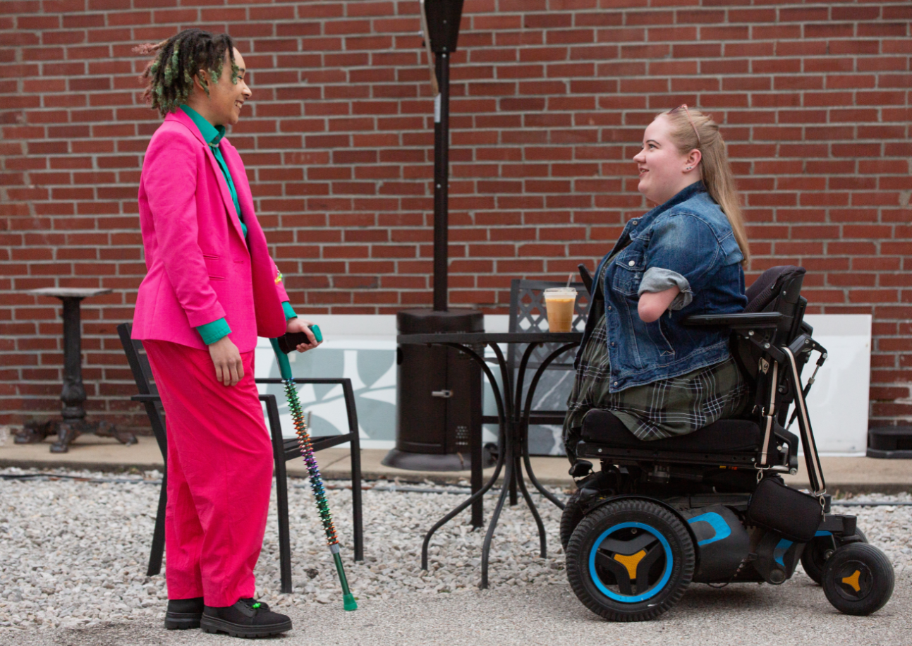 Two disabled women in coversation.